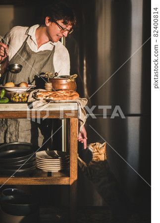 Woman cooking Turkish traditional meat soup Woman cooking Turkish traditional meat soup 82400814