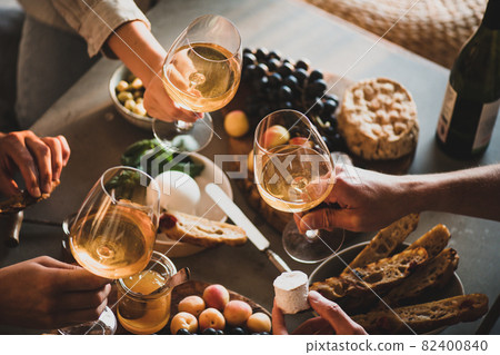 Group of unrecognizable people holding glasses of 82400840