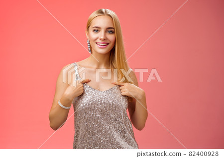 Boastful good-looking confident blond european woman in silver luxurious dress pointing herself smiling proudly bragging talking own accomplishments goals standing red background self-assured Boastful good-looking confident blond european woman in silver luxurious dress pointing herself smiling proudly bragging talking own accomplishments goals standing red background self-assured 82400928