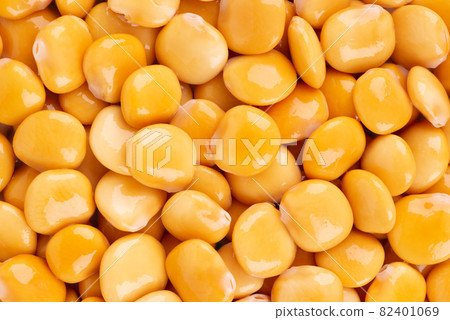 Pickled yellow lupine beans background. Tournus, preserved lupinus. Pickled yellow lupine beans background. Tournus, preserved lupinus. 82401069