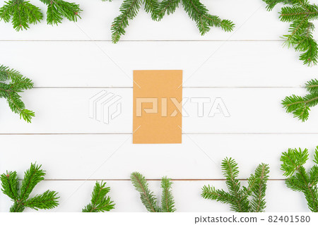 Christmas greeting card background with copy space on white wooden background Christmas greeting card background with copy space on white wooden background 82401580