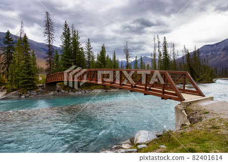 Bridge over the Glacier River in Canadian Rocky Mountain Landscape. 82401614