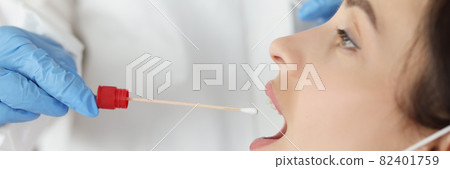 Doctor in front of biological material of saliva from patient for diagnosis of covid Doctor in front of biological material of saliva from patient for diagnosis of covid 82401759