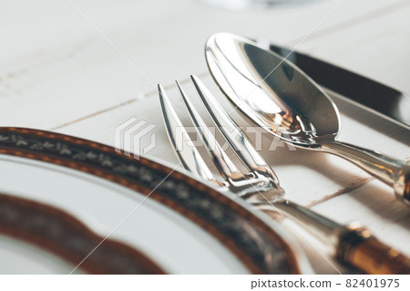 Close up shot of table setting for fine dining with cutlery and glassware 82401975