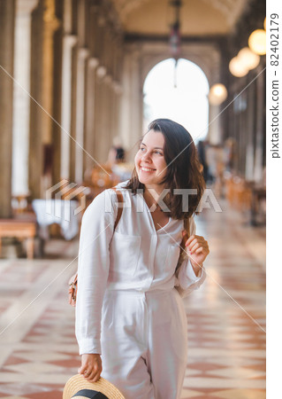 portrait of smiling woman in white clothes portrait of smiling woman in white clothes 82402179