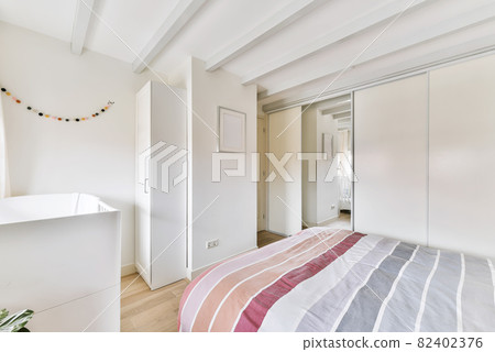 Designed in a minimalistic style bedroom interior 82402376