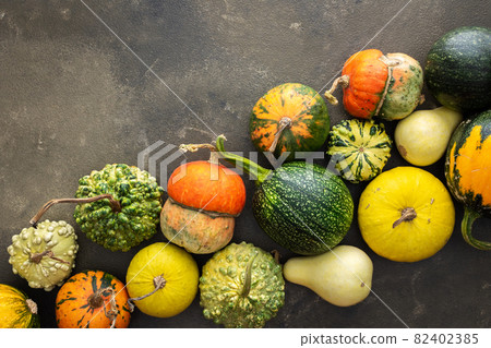 Pumpkins on a green background 82402385