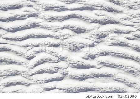 Texture of Pamukkale calcium travertine in Turkey, white pattern of horizontal waves, close-up. Texture of Pamukkale calcium travertine in Turkey, white pattern of horizontal waves, close-up. 82402990