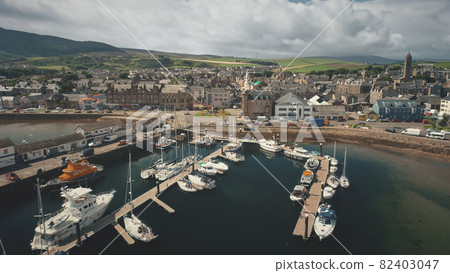 Harbor town cityscape at marina aerial. Downtown streets, traffic road. Campbeltown modern buildings 82403047