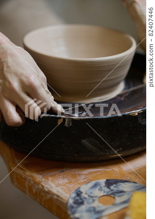 Creation of a new bowl on a pottery wheel Creation of a new bowl on a pottery wheel 82407446