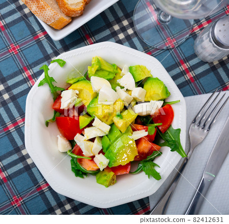 Fresh summer salad with vegetables and cheese Fresh summer salad with vegetables and cheese 82412631