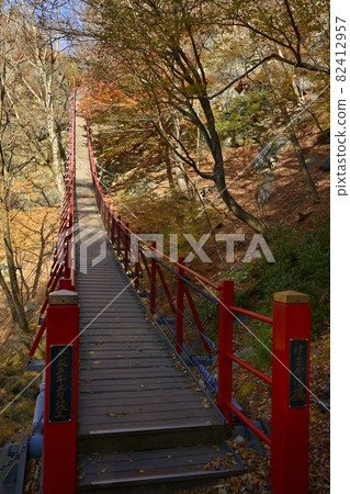 Kasaya bridge on the promenade to the autumnal trees and small, medium and large waterfalls Kasaya bridge on the promenade to the autumnal trees and small, medium and large waterfalls 82412957