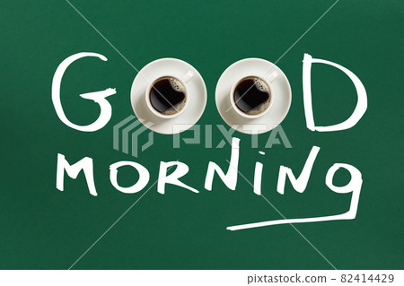 Close-up top view of cup of fresh hot coffee and good morning inscription 82414429