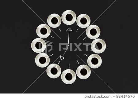 Cups with coffee, stacked in a circle. Clock consist of twenty cups. Black background. Concept time to coffee Cups with coffee, stacked in a circle. Clock consist of twenty cups. Black background. Concept time to coffee 82414570
