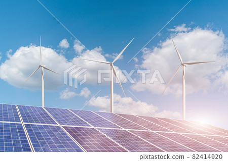 Solar panels with wind turbines generating electricity on blue sky cloud background Solar panels with wind turbines generating electricity on blue sky cloud background 82414920