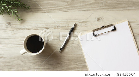 Coffee and white paper on the desk 82416504