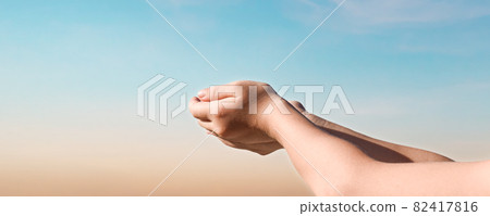 Hands reaching for the sky sunset background. Hope concept Hands reaching for the sky sunset background. Hope concept 82417816