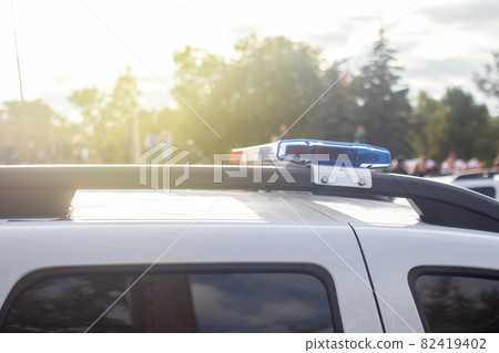 Close-up of police cars without labels or markings. A parade of cars of the defenders of order and tranquility. The work of the special services. Place for text Close-up of police cars without labels or markings. A parade of cars of the defenders of order and tranquility. The work of the special services. Place for text 82419402