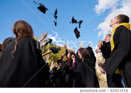 Group of diverse international graduating students celebrating 82421418
