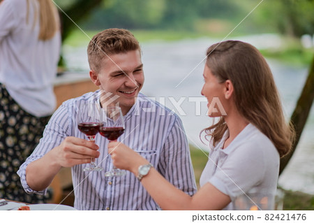 friends having picnic french dinner party outdoor during summer holiday friends having picnic french dinner party outdoor during summer holiday 82421476