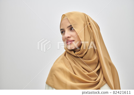 Portrait of young muslim woman wearing hijab on isolated white background 82421611