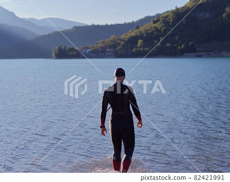 triathlete swimmer portrait wearing wetsuit on training 82421991