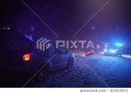car accident on slippery winter road at night 82422653