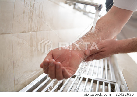 a group of Muslims take ablution for prayer. Islamic religious rite a group of Muslims take ablution for prayer. Islamic religious rite 82422659