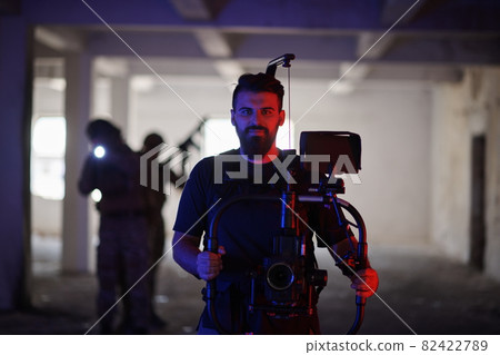 Videographer Taking Action Shoot of Soldiers in Action urban environment 82422789