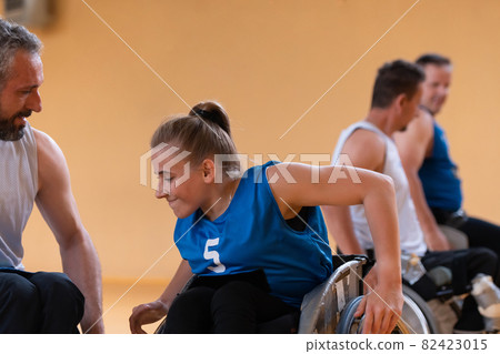 a young woman playing wheelchair basketball in a professional team. Gender equality, the concept of sports with disabilities.  82423015