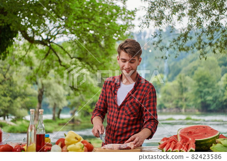 man cooking tasty food for french dinner party man cooking tasty food for french dinner party 82423586