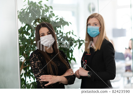 business team in protective medical mask at modern office 82423590