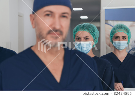 orthopedic doctor working together with his multiethnic team orthopedic doctor working together with his multiethnic team 82424895