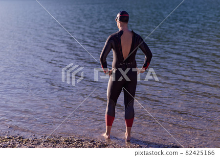 triathlete swimmer portrait wearing wetsuit on training triathlete swimmer portrait wearing wetsuit on training 82425166