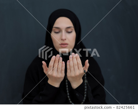 Portrait of young Muslim woman making dua Portrait of young Muslim woman making dua 82425661