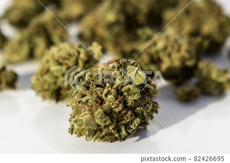 Marijuana pieces on isolated white background 82426695