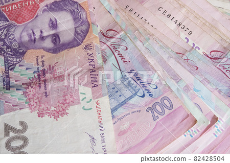 A bunch of banknotes with a face value of two hundred hryvnias. Ukrainian money. 82428504