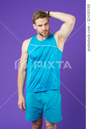 Sportsman after training feel pleasant aroma. Guy check  82430598