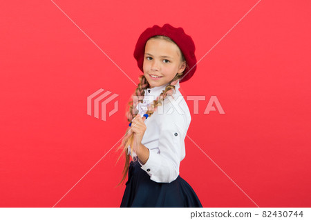 Fancy style. Little girl with braids ready for school.  82430744