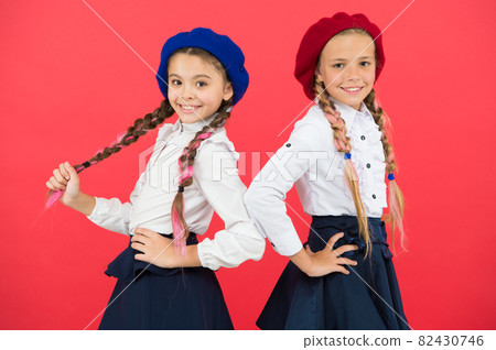 On same wave. Schoolgirls wear formal school uniform.  82430746