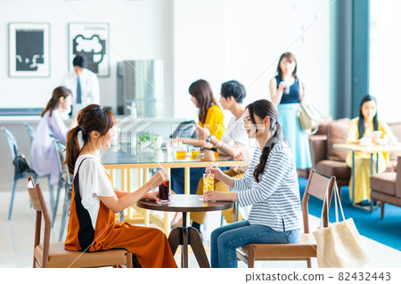 People relaxing in a cafe People relaxing in a cafe 82432443