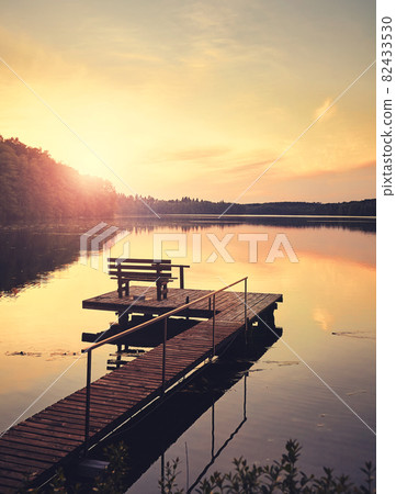 Lake Lipie at sunset, color toning applied, Poland. Lake Lipie at sunset, color toning applied, Poland. 82433530