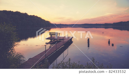 Lake Lipie at sunset, color toning applied, Poland. Lake Lipie at sunset, color toning applied, Poland. 82433532