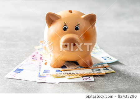Euro banknotes and piggy bank. Savings money concept Euro banknotes and piggy bank. Savings money concept 82435290