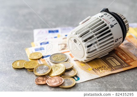 Thermostatic head and Euro money. Banknotes and coins. Thermostatic head and Euro money. Banknotes and coins. 82435295