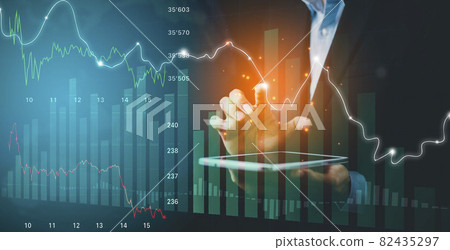 Businessman touchscreen line of Stock market or forex trading graph and candlestick chart suitable for financial investment concept,Economy trends background for business idea and all art work design. Businessman touchscreen line of Stock market or forex trading graph and candlestick chart suitable for financial investment concept,Economy trends background for business idea and all art work design. 82435297
