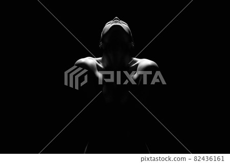 Nude Young Woman silhouette in the dark 82436161