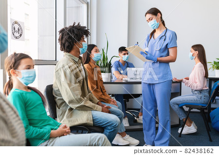 Diverse Patients Waiting For Covid-19 Vaccination Sitting In Queue Diverse Patients Waiting For Covid-19 Vaccination Sitting In Queue 82438162