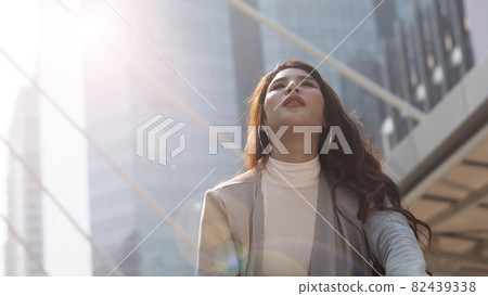 Lay off. Sacked. Fired business woman sitting on stairs of office building outside. Depressed young business woman unemployment due to coronavirus crisis. worry no job no money. Laid off got fired. 82439338