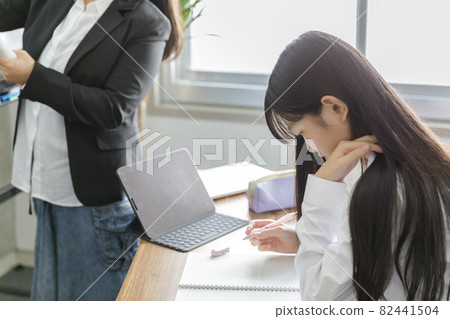 High school girl studying at a cram school High school girl studying at a cram school 82441504